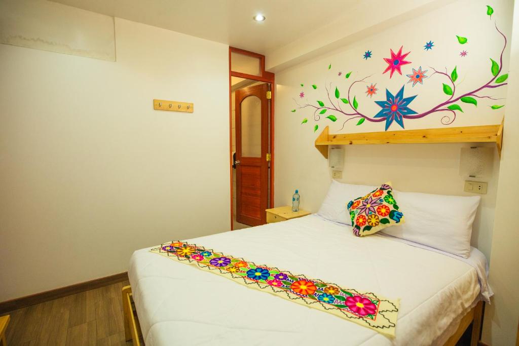Postel nebo postele na pokoji v ubytování Hotel Ruta Amazónica Machupicchu