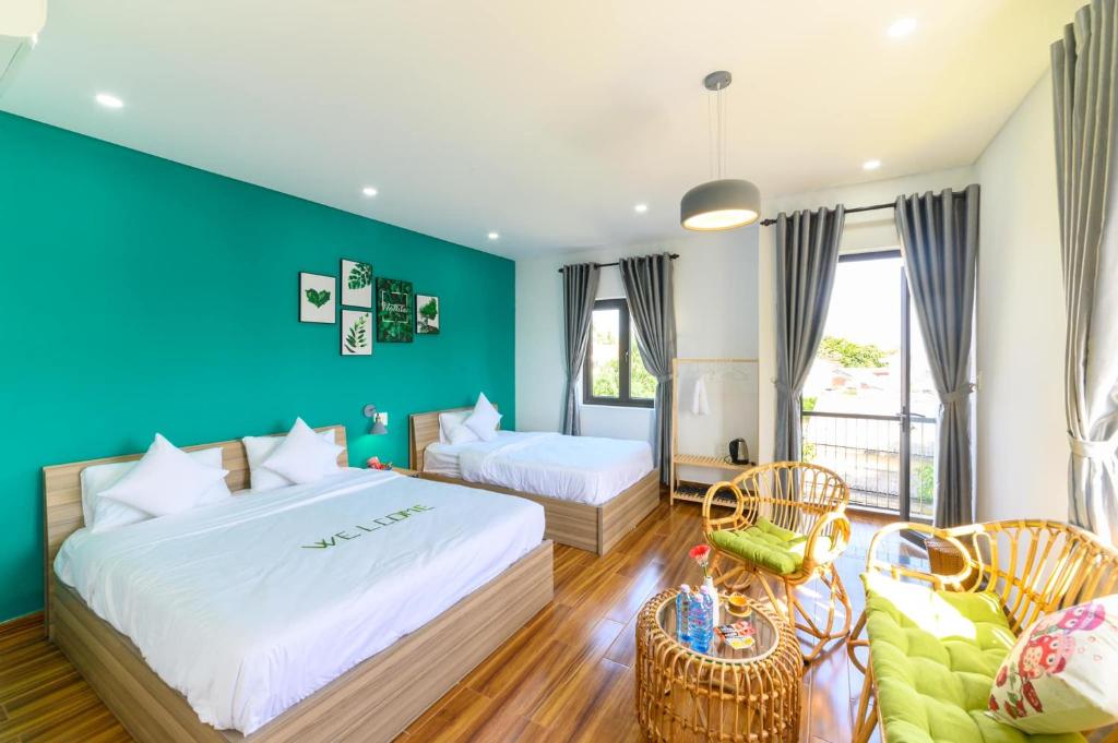 Postel nebo postele na pokoji v ubytování Kivi Homestay Hoi An