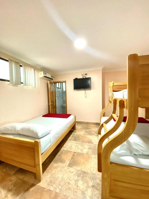 Postel nebo postele na pokoji v ubytování HOTEL MARLUZ