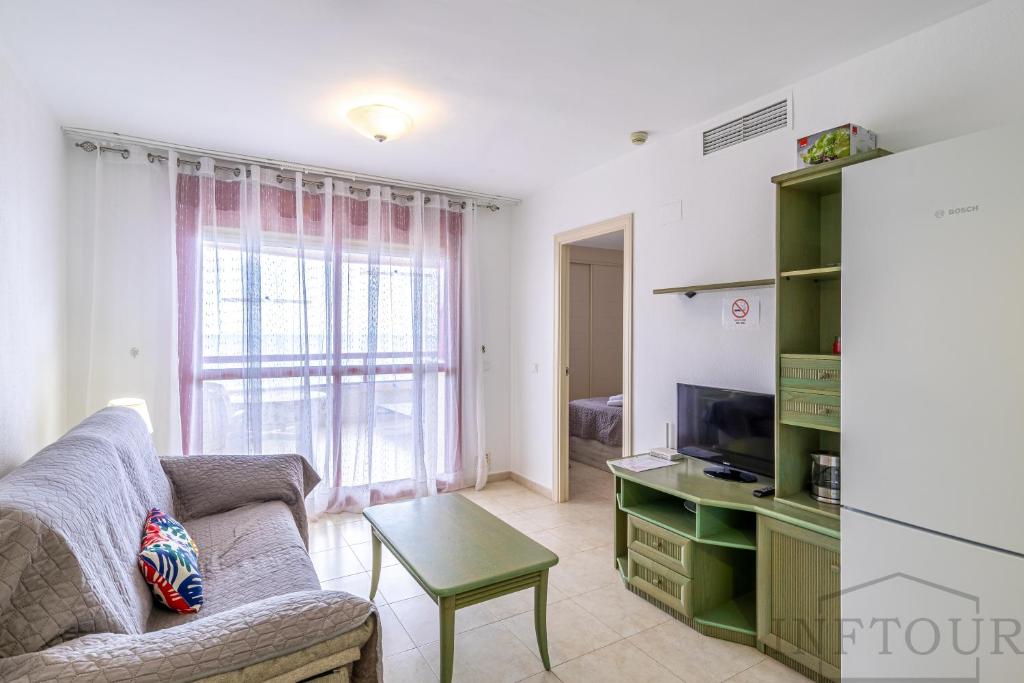 TV a/nebo společenská místnost v ubytování Inftour Amatista 9 Apartamento