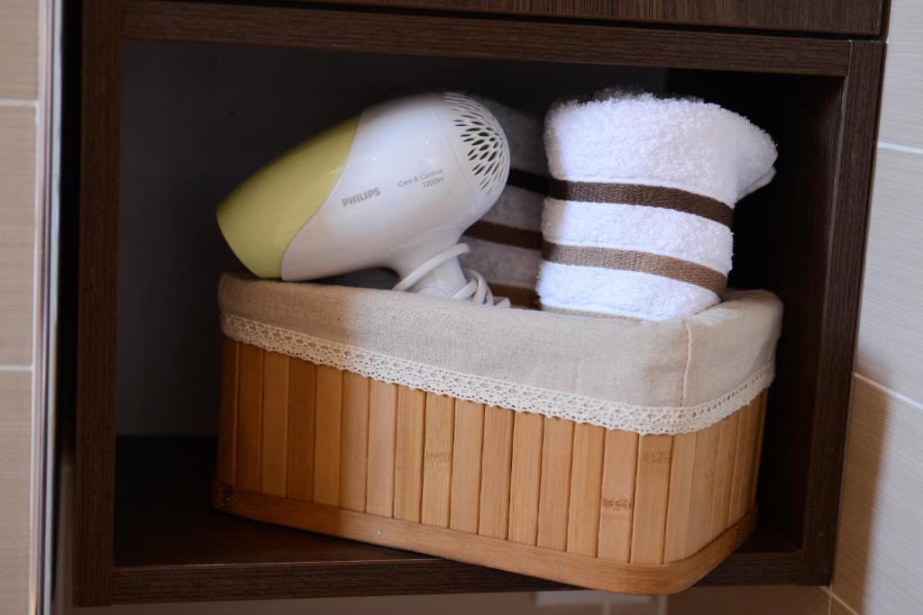 a wooden box with a hair dryer and a hair brush at Apartments Belvedere in Belgrade