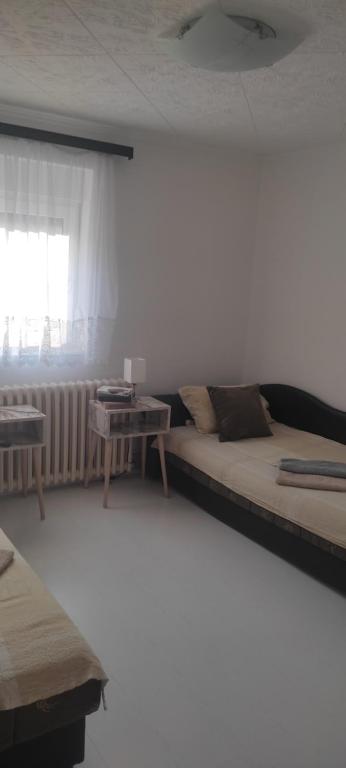 Postel nebo postele na pokoji v ubytování Mali Vrt