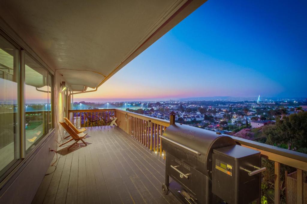 a balcony of a house with a view of a city at Red Hawk Coastal Estate in San Diego