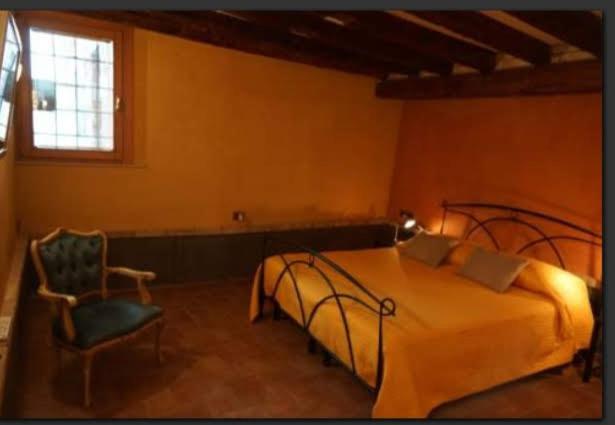 Postel nebo postele na pokoji v ubytování Casa delle gondole