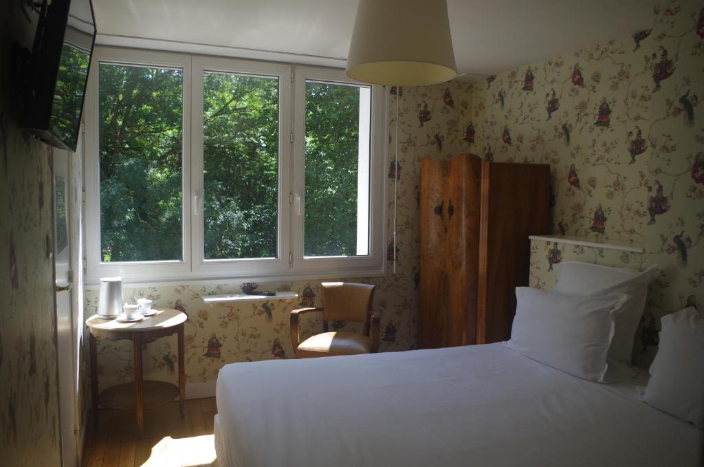 Postel nebo postele na pokoji v ubytování Hotel Richelieu