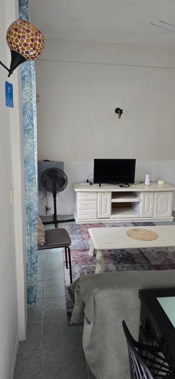 TV a/nebo společenská místnost v ubytování Grand Baie View Appart