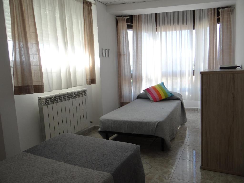 Postel nebo postele na pokoji v ubytování Manresa Apartamentos Turísticos