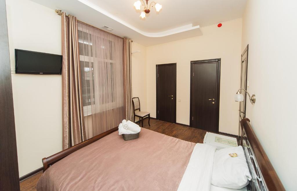 Postel nebo postele na pokoji v ubytování Zenith Hotel