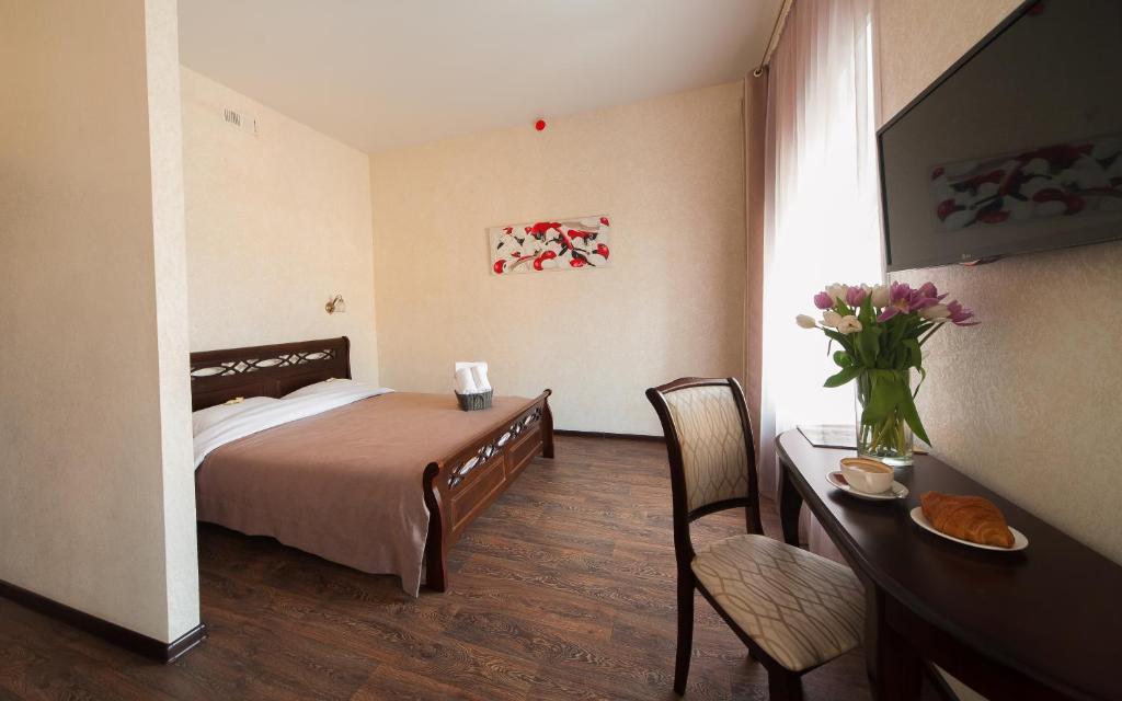 Postel nebo postele na pokoji v ubytování Zenith Hotel