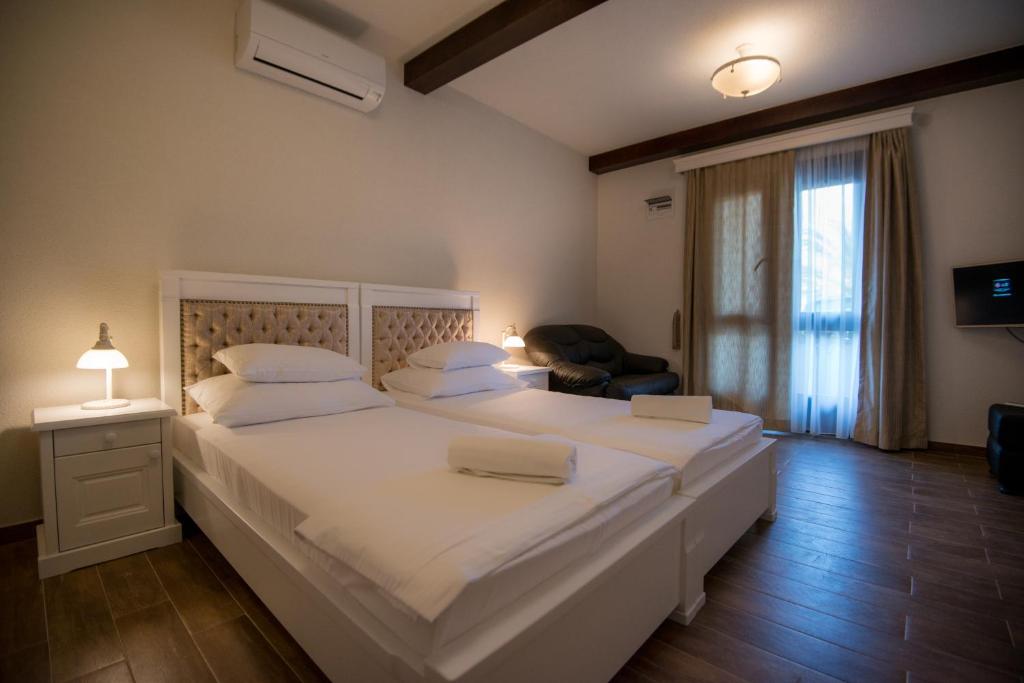 Postel nebo postele na pokoji v ubytování Apartments Marija