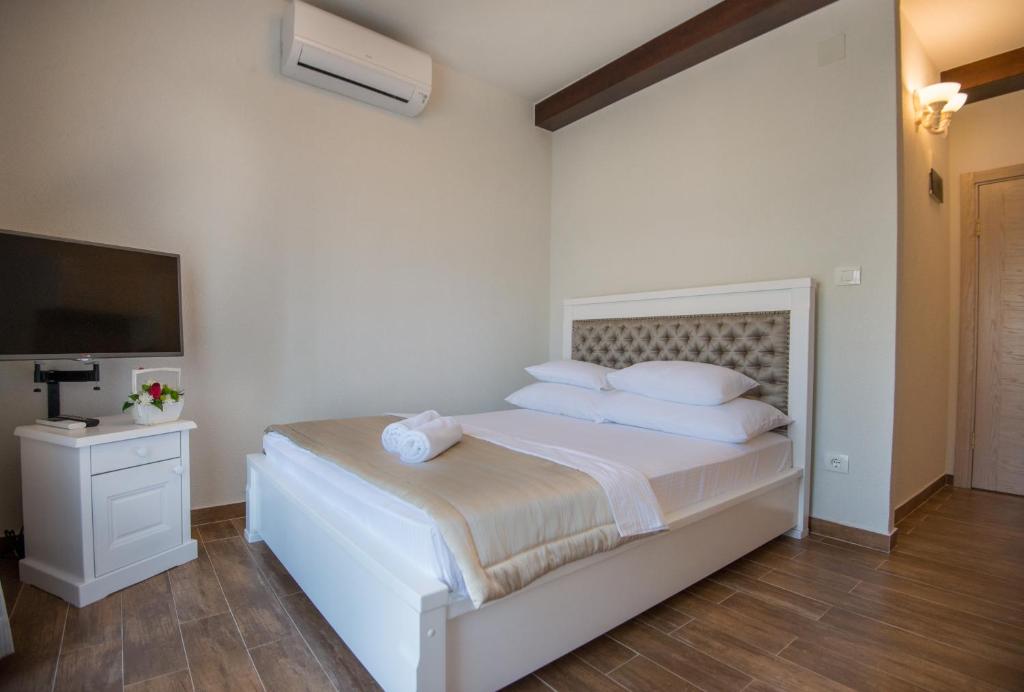 Postel nebo postele na pokoji v ubytování Apartments Marija