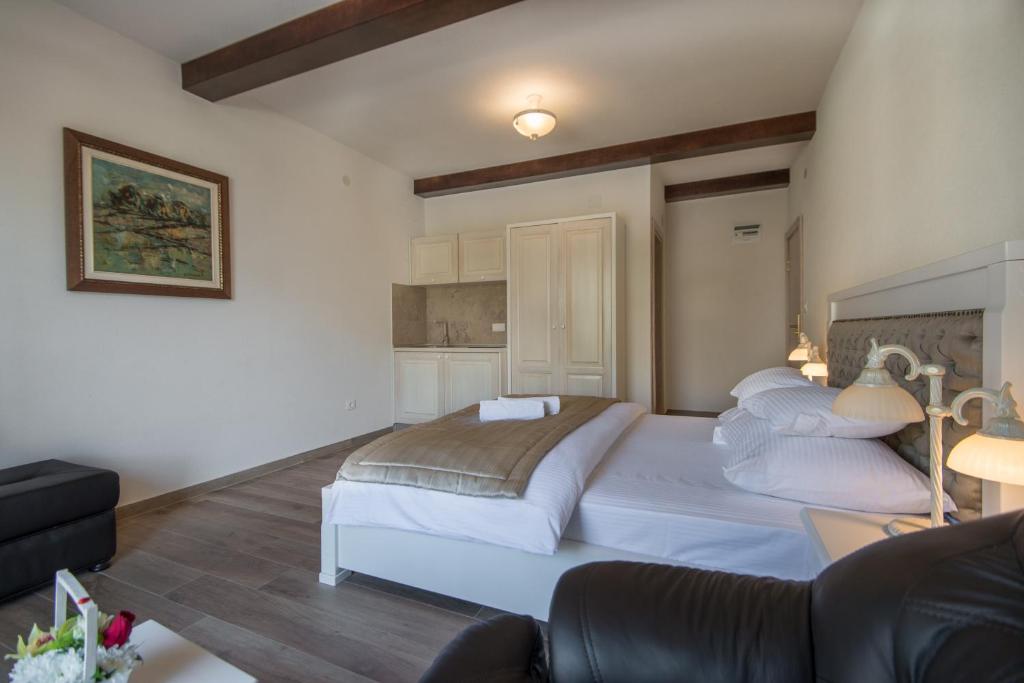 Postel nebo postele na pokoji v ubytování Apartments Marija