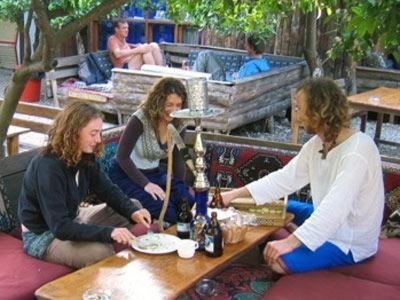 a group of three women sitting at a table at Bayrams Tree Houses in Olympos