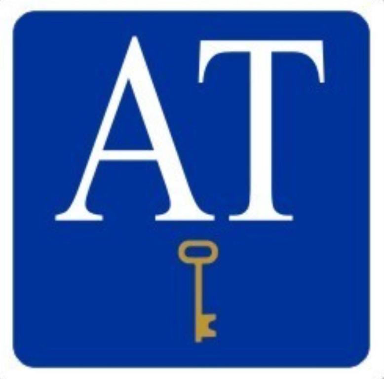 a blue and white sign with the lettersait and a key at Nazareno in Villanueva de la Serena