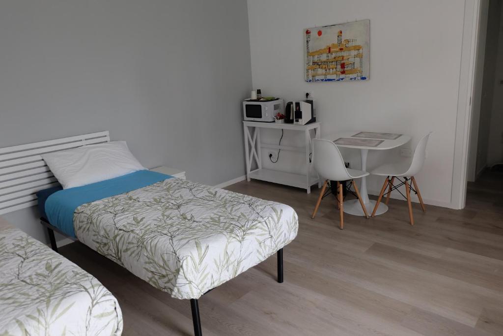 Postel nebo postele na pokoji v ubytování Adriroomsrho