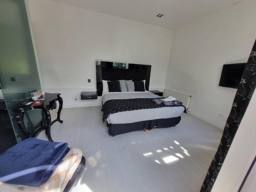 Postel nebo postele na pokoji v ubytování Winery Hotel Boutique