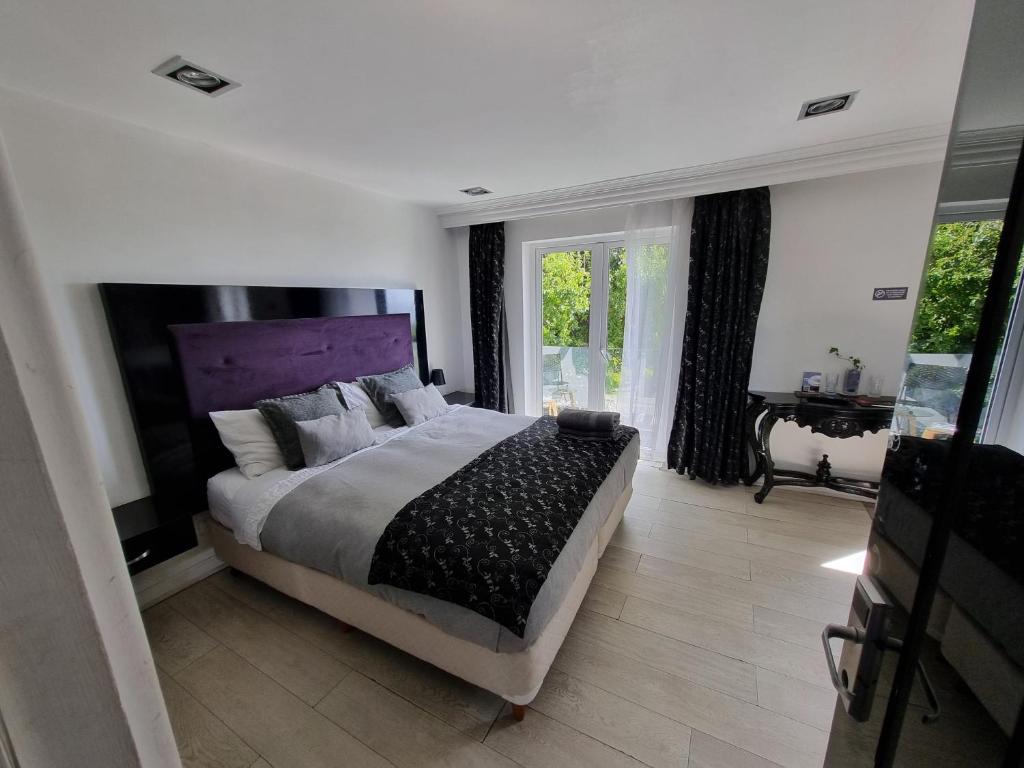 Postel nebo postele na pokoji v ubytování Winery Hotel Boutique
