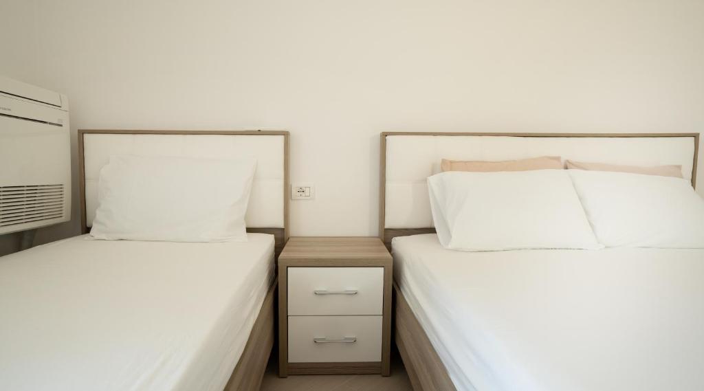 Voodi või voodid majutusasutuse Albora's Seaside Apartment toas