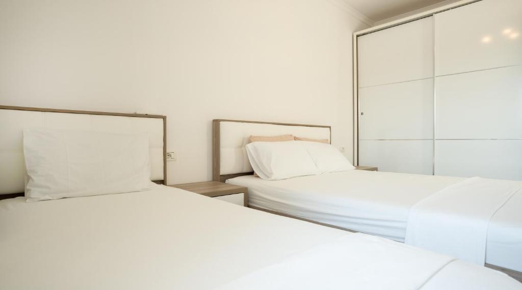 Voodi või voodid majutusasutuse Albora's Seaside Apartment toas