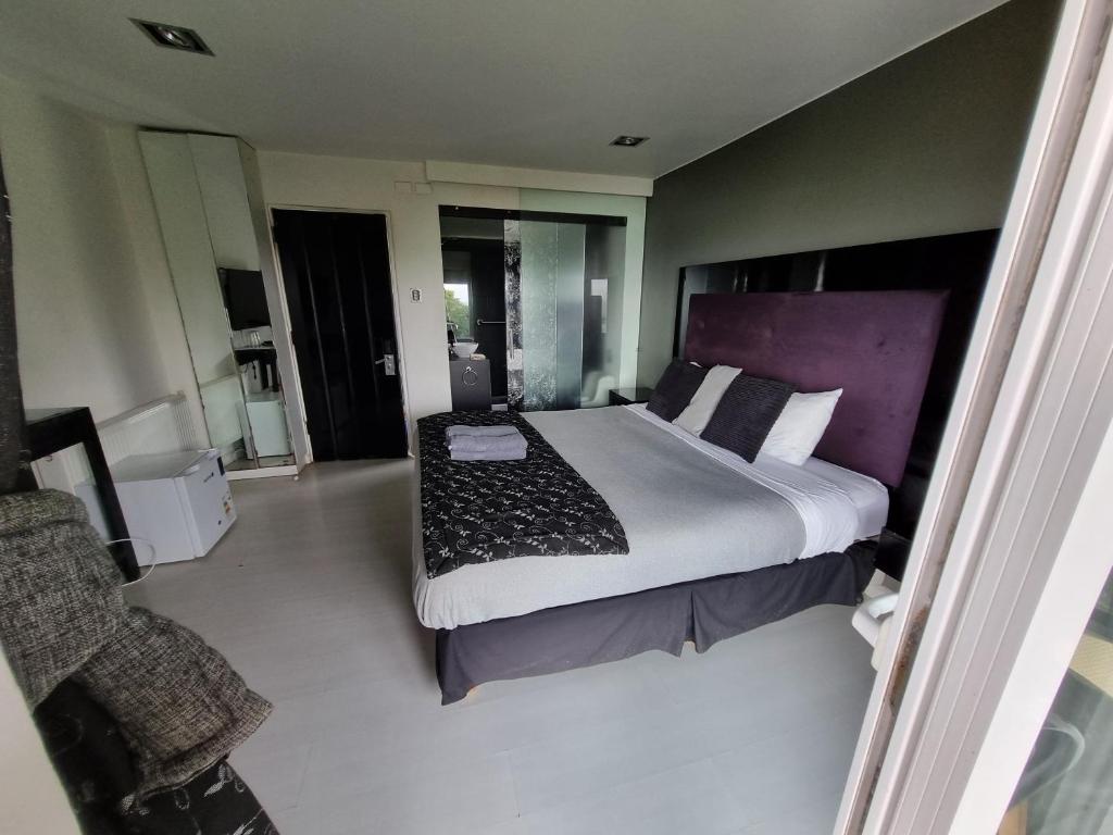 Postel nebo postele na pokoji v ubytování Winery Hotel Boutique