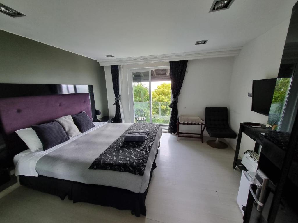 Postel nebo postele na pokoji v ubytování Winery Hotel Boutique