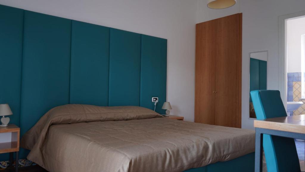 Postel nebo postele na pokoji v ubytování Hotel L'Isola