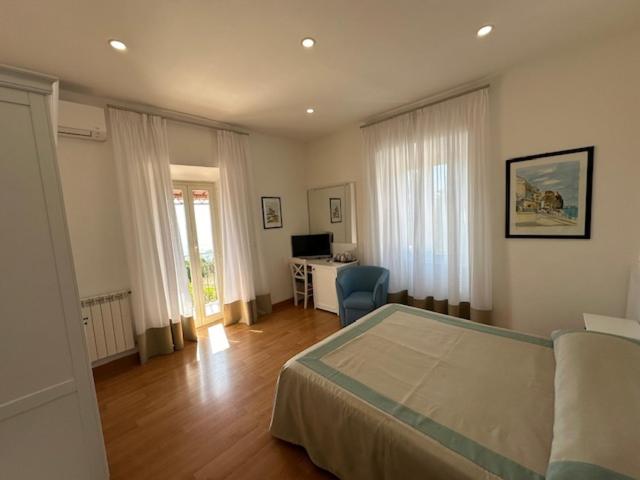 Postel nebo postele na pokoji v ubytování Hotel L'Isola