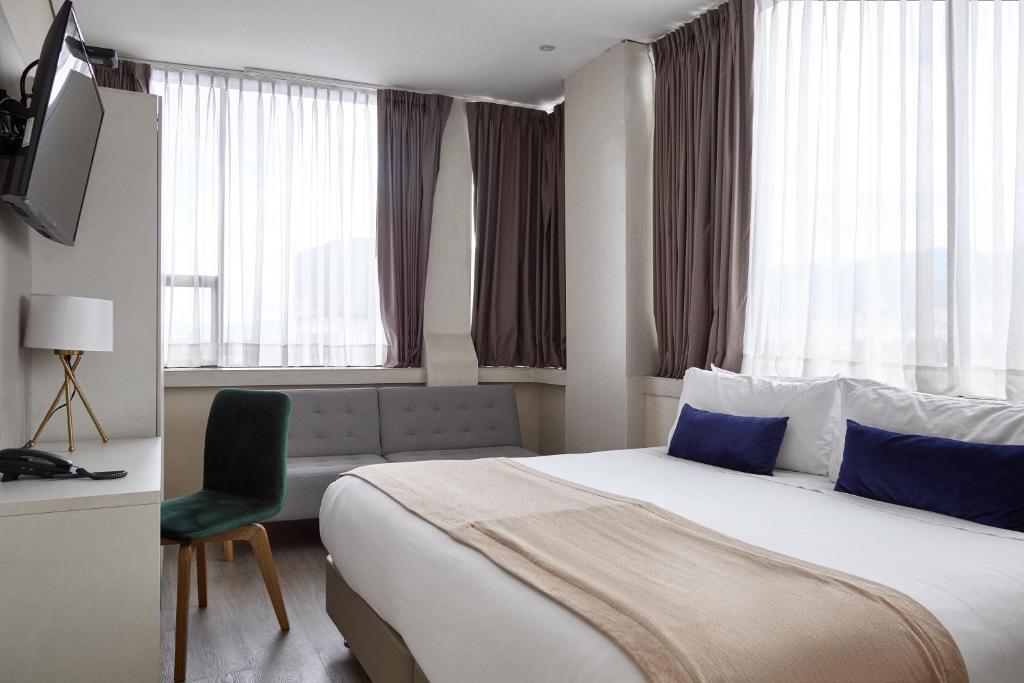 Postel nebo postele na pokoji v ubytování Hotel City Bog Corferias