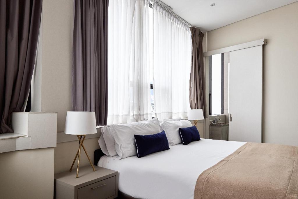 Postel nebo postele na pokoji v ubytování Hotel City Bog Corferias
