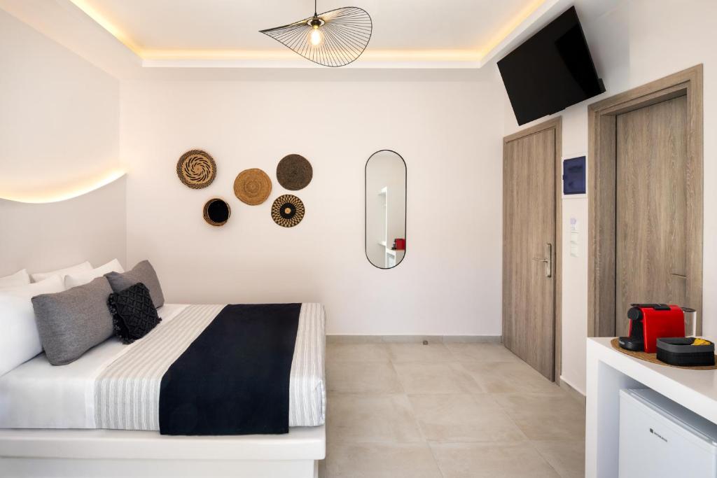 Letto o letti in una camera di Santorinn Suites Fira