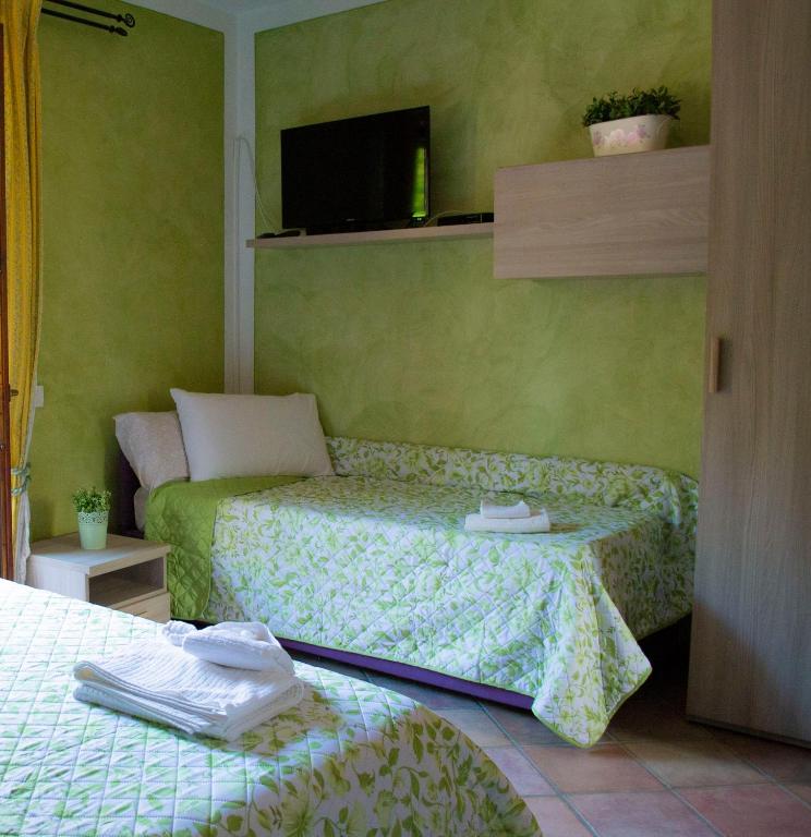 Postel nebo postele na pokoji v ubytování Casa di Nina