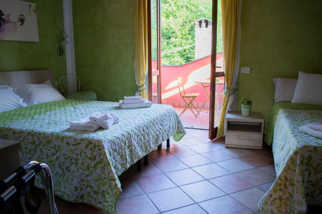 Postel nebo postele na pokoji v ubytování Casa di Nina