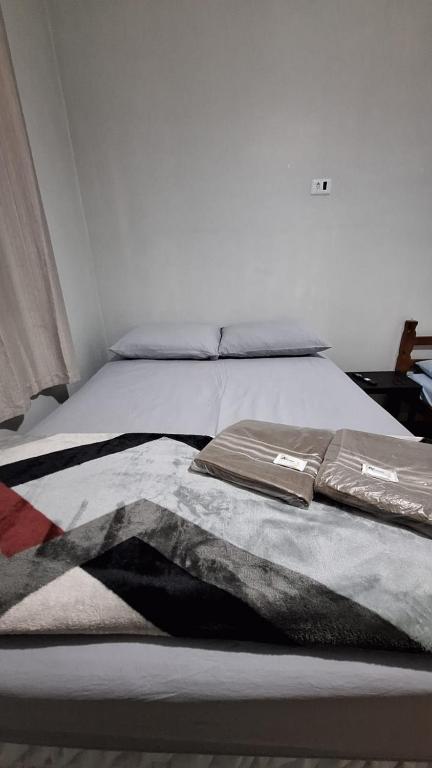 Postel nebo postele na pokoji v ubytování Hostel My House quartos perto do aeroporto de Guarulhos