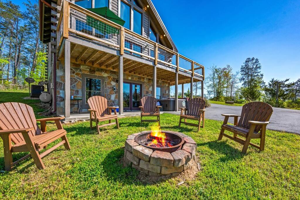 a group of chairs sitting around a fire pit at Good Times 2 - Family Lodge-Fire Pit, Theater, Hot Tub & Pool Table in Sevierville