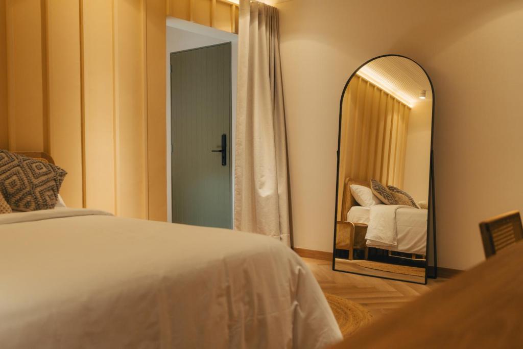 Postel nebo postele na pokoji v ubytování Hotel Boutique Roomzz Laureles