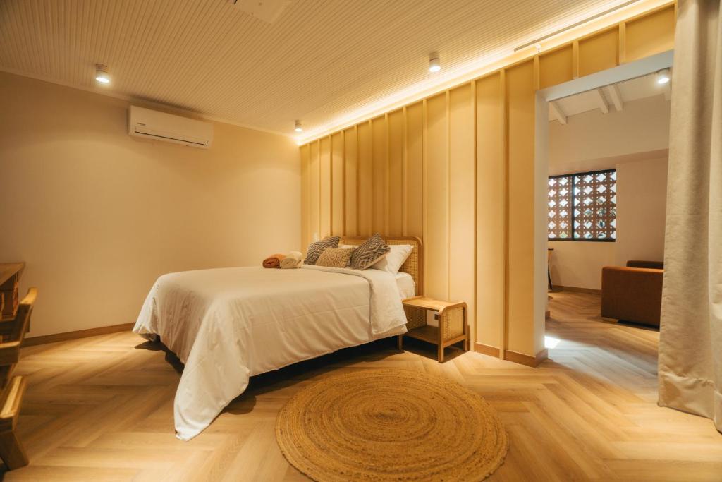 Postel nebo postele na pokoji v ubytování Hotel Boutique Roomzz Laureles