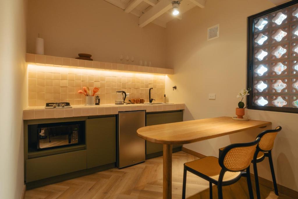 Kuchyň nebo kuchyňský kout v ubytování Hotel Boutique Roomzz Laureles