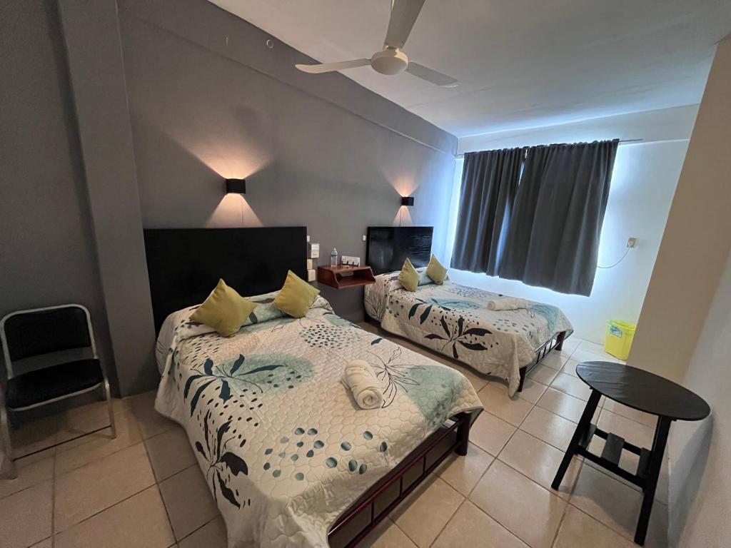 Postel nebo postele na pokoji v ubytování Hotel Las Brisas