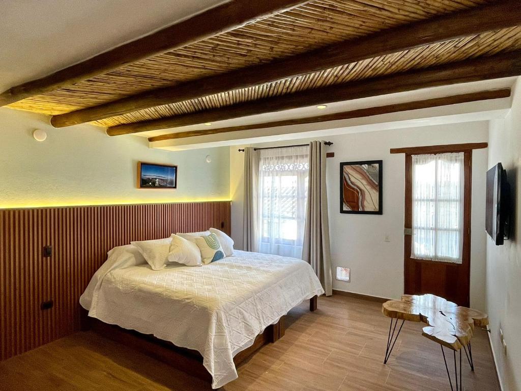 Postel nebo postele na pokoji v ubytování Hotel Boutique Cenit