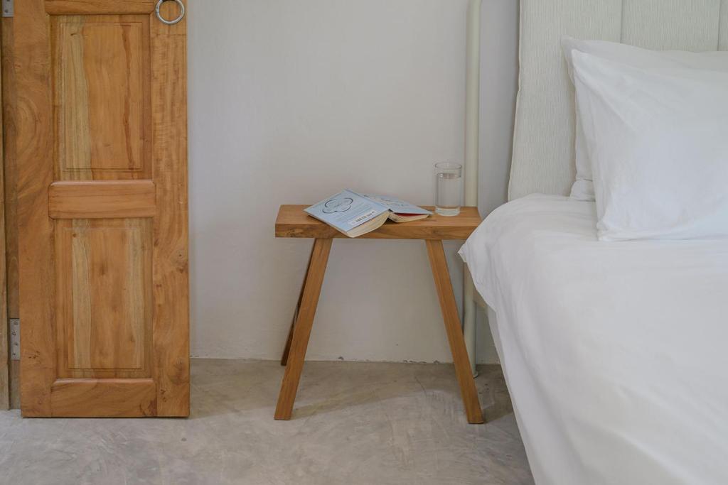 Postel nebo postele na pokoji v ubytování Boonya Swiss Home