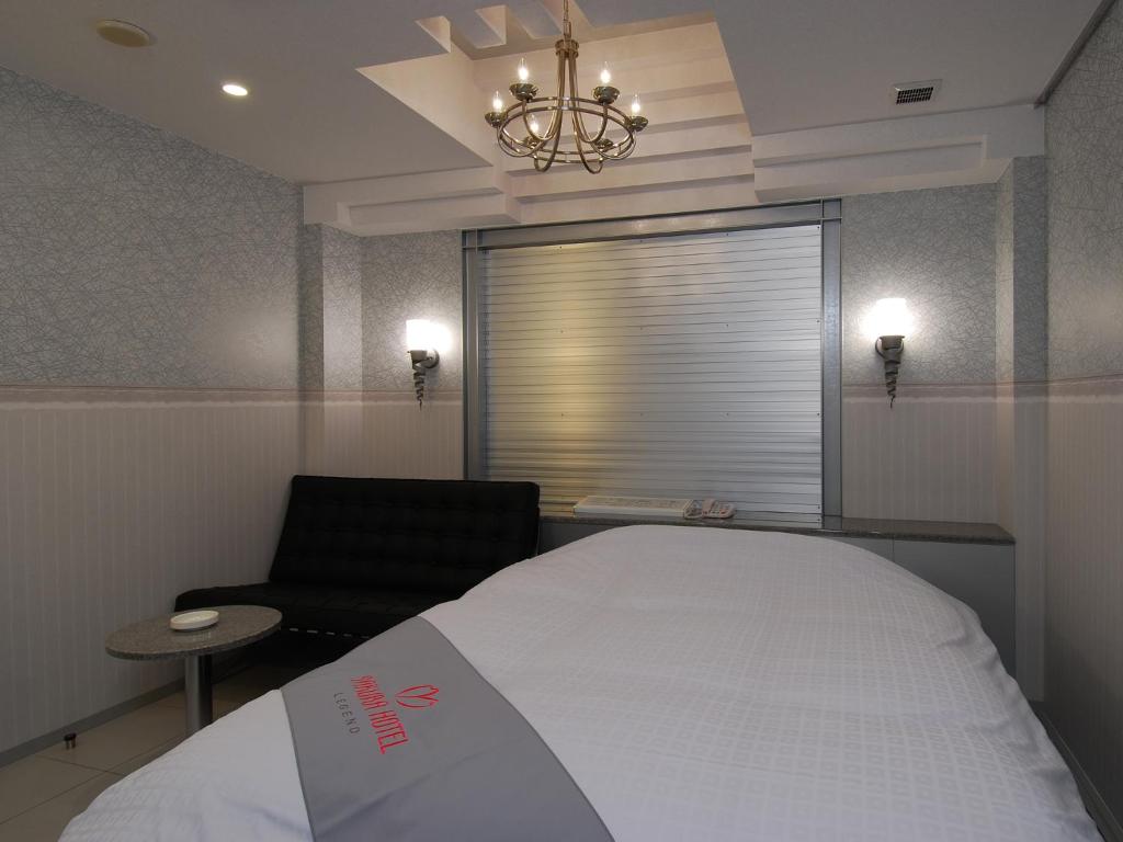 Postel nebo postele na pokoji v ubytování ホテルレジェンドプラス-Adult only