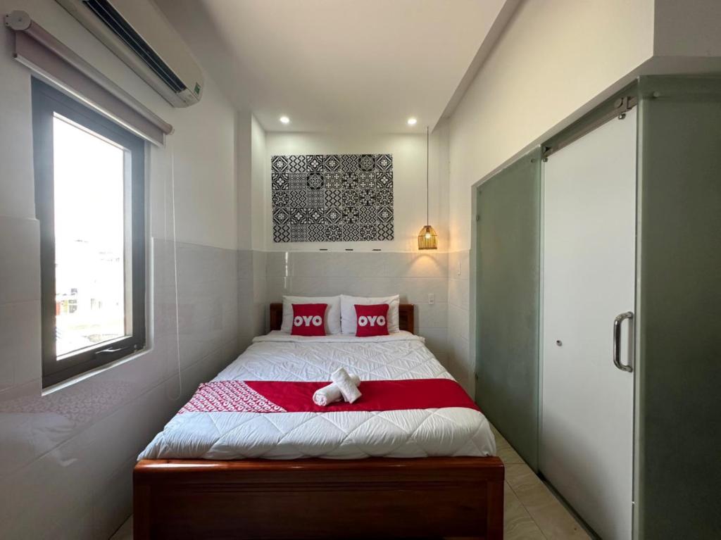 Postel nebo postele na pokoji v ubytování Tây Nguyên Hotel Đà Nẵng