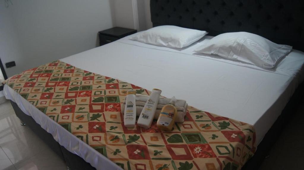 Postel nebo postele na pokoji v ubytování Acogedor Apto familiar con linda vista en Sta Marta ciudad Fam-friendly Home with Views in Santa Marta