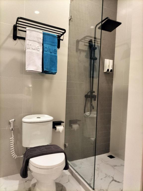 Koupelna v ubytování True Blue Hotel Menteng