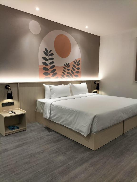 Postel nebo postele na pokoji v ubytování True Blue Hotel Menteng