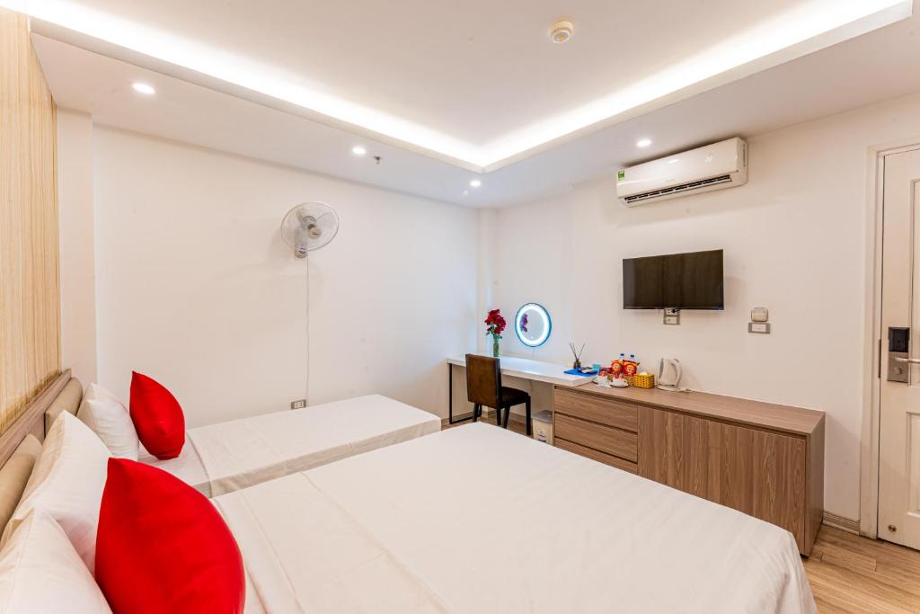 Postel nebo postele na pokoji v ubytování Moon Hotel 2 Đỗ Quang