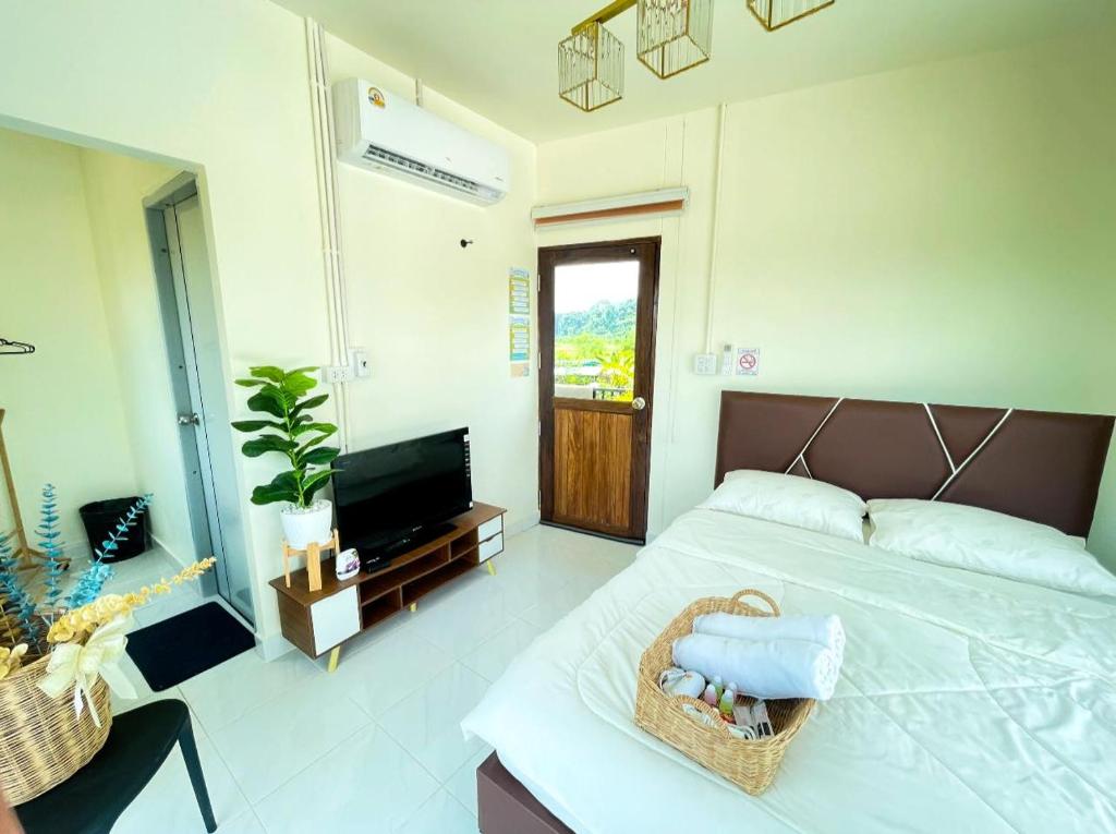 Postel nebo postele na pokoji v ubytování ภูผา เฮ้าส์ รีสอร์ท