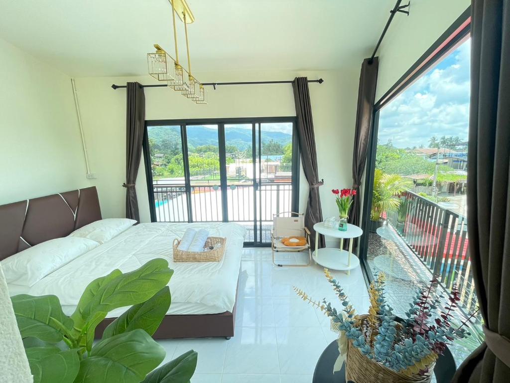 Postel nebo postele na pokoji v ubytování ภูผา เฮ้าส์ รีสอร์ท