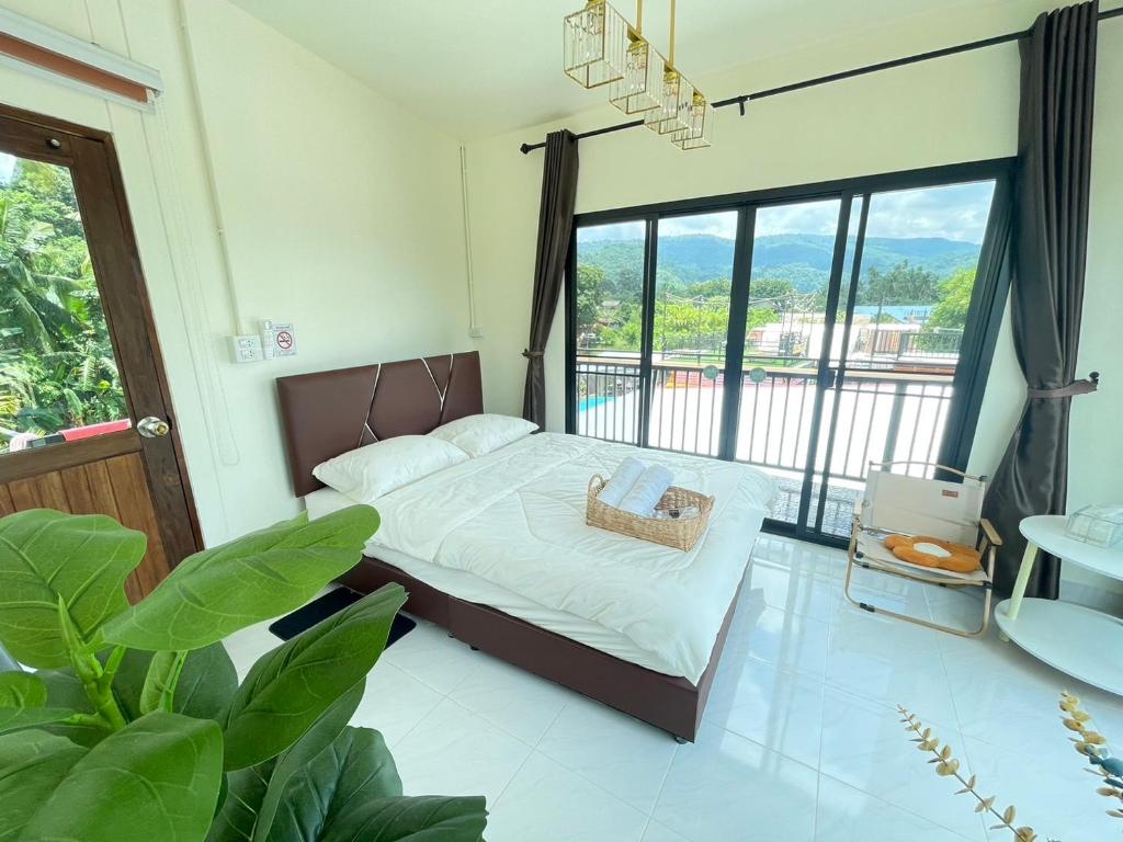 Postel nebo postele na pokoji v ubytování ภูผา เฮ้าส์ รีสอร์ท