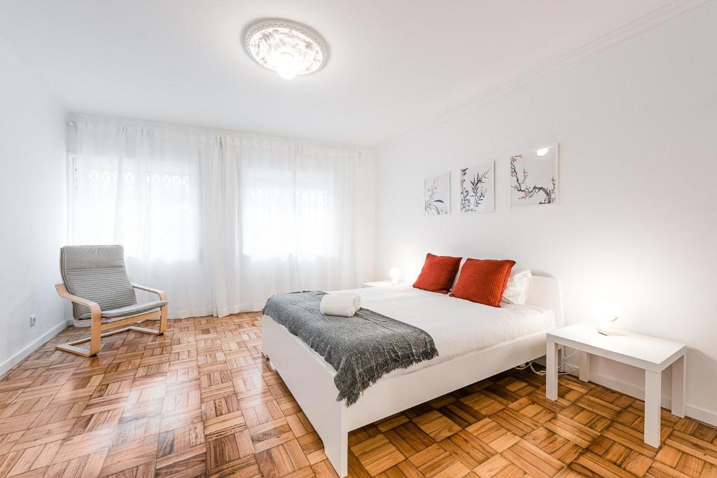 Un pat sau paturi într-o cameră la GuestReady - Hospitality Atrium - Leite Residence